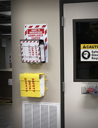 SDS binder and compliance material displayed for workers